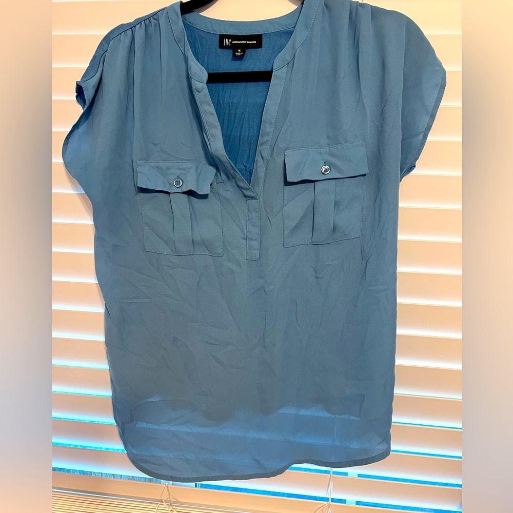 Powder Blue top, silky material. Gently worn. Size medium.